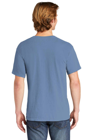 A person with light brown hair is seen from the back wearing a Comfort Colors Heavyweight Ring Spun Pocket T-Shirt 6030 in light blue and blue jeans.