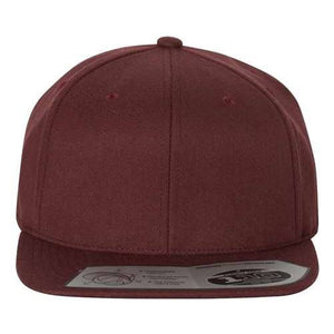 The Flexfit 110® Flat Bill Snapback Hat by Flexfit is a maroon-colored, structured six-panel baseball cap featuring a flat brim and an adjustable snapback closure, complete with a sticker on it for authenticity.