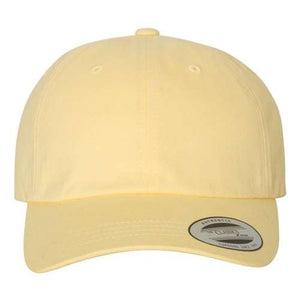 A yellow YP Classics 6245PT Peached Cotton Twill Dad Hat with a buckle closure on a white background.