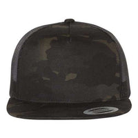 A black trucker hat with a camouflage Multicam pattern, the Yupoong Classics 5089M Five-Panel Classic Trucker Cap by YP Classics.