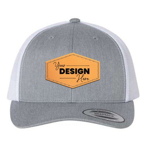 This YP Classics hat, the Yupoong Classics Six-Panel Retro Trucker Snapback Hat 6606, features a customizable orange patch that says "Your Design Here" and a breathable mesh back for added comfort. With its secure snapback closure, it's the perfect accessory to showcase your unique style.