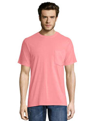 A man wearing a Hanes Workwear Pocket Safety T-Shirt with a tear away label.