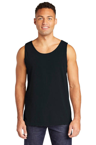 A person wearing the Comfort Colors Heavyweight Ring Spun Tank Top 9360 in classic black, paired with jeans, stands against a plain white background, exuding a timeless vintage look.
