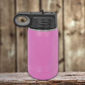 A pink Custom Kids Water Bottle 12 oz Personalized with your Logo, Design or Names - Special New Years Sale Bulk Pricing - LIMITED TIME with a black flip-top lid on a wooden surface by Kodiak Coolers.
