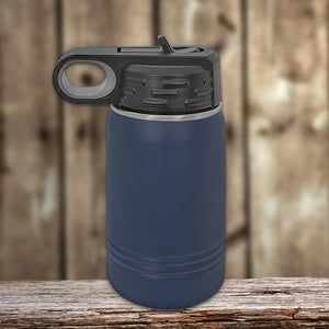 Blue Kodiak Coolers vacuum-sealed insulated water bottle on a wooden surface with a flip-top lid.