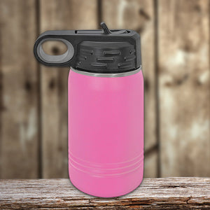 Pink Kodiak Coolers personalized insulated water bottle with black lid on a wooden surface.