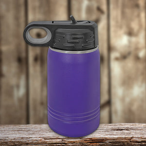 A purple Custom Kids Water Bottles 12 oz Personalized with your Logo, Design or Names - Special New Years Sale Bulk Pricing - LIMITED TIME bottle with a black flip lid, sitting on a wooden surface against a blurred wooden background.