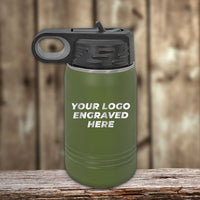 The Kodiak Coolers custom engraved drinkware features a green insulated bottle with a black lid, ideal for branding. It includes "Your logo engraved here" text against a blurred wooden background. Enjoy no setup fee and 1-side logo inclusion with a $250 minimal order for the Presidents Day sale.