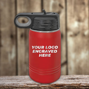 A red insulated bottle with a laser-engraved logo and "Your Logo Engraved Here" sits on wood against a blurred wooden backdrop. Perfect for custom tumblers, Kodiak Coolers offers these bottles at competitive wholesale prices in the Custom Engraved Drinkware collection.
