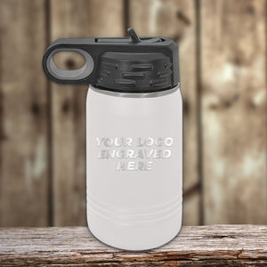 A youthful white Custom Kids Water Bottle 12 oz Personalized with your Logo, Design or Names - Special Bulk Wholesale Volume Pricing, with a stylish black Kodiak Coolers lid, sitting on a wooden table.