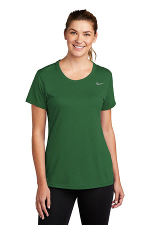 Woman wearing a green Nike Ladies Legend T-Shirt with Dri-FIT technology and black pants smiling at the camera.