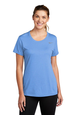 Woman wearing a blue Nike Ladies Legend T-Shirt CU7599 smiling at the camera.