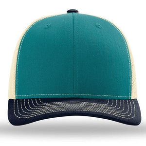 Front view of the Richardson 112 Snapback Trucker Cap by Richardson in teal and beige, featuring a black brim, white stitching, custom embroidery, and a breathable mesh back.