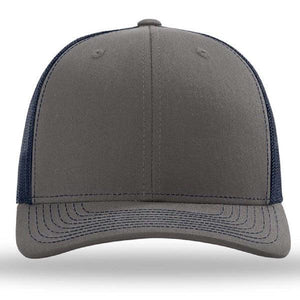 The Richardson 112 Snapback Trucker Cap by Richardson features custom embroidery, a curved brim, front panel, and mesh back in gray and navy blue, made from a cotton/polyester blend.