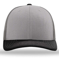 The Richardson 112 Snapback Trucker Cap by Richardson is a custom embroidered hat featuring a gray front panel, black bill and stitching, and a breathable mesh back, shown from the front.