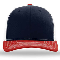 The Richardson 112 Snapback Trucker Cap by Richardson features a navy blue front, white mesh back and sides, and a red curved brim, shown from the front view. Custom embroidered design available.
