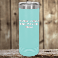 A light blue stainless steel tumbler by Kodiak Coolers with your custom company logo engraved, ideal as a realtor closing gift for clients, displayed on a rustic wooden surface with a blurred wooden background.