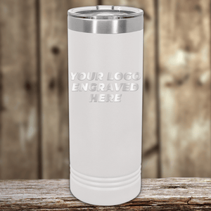 A white insulated tumbler with a silver rim and lid by Kodiak Coolers is ideal as Realtor Closing Gifts for Clients. "YOUR LOGO ENGRAVED HERE" highlights your custom company logo—perfect for personalized drinkware promotions.