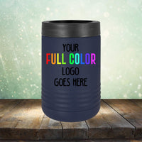 A black Custom UV Printed Drinkware - ONE TIME SPECIAL OFFER by Kodiak Coolers against a blurred, sparkly background, with the text "YOUR FULL COLOR LOGO GOES HERE" in white and colorful letters. Perfect for engraving, the tumbler stands on a wooden surface.