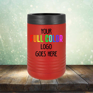 Red insulated **Kodiak Coolers** tumbler with a black lid placed on a wooden surface. The text on the customized tumbler reads "**Custom UV Printed Drinkware - Single Side Printing Included in Price**" in various colors. The background is a blurred, sparkly light scene.