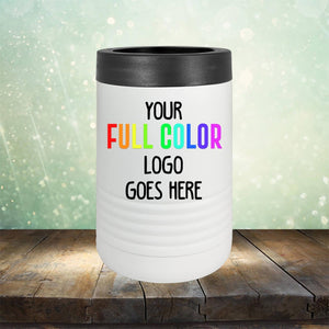 A white cylindrical container with a black lid on a wooden surface. The container, reminiscent of sleek Tumblers, has text saying "Custom UV Printed Drinkware - ONE TIME SPECIAL OFFER" in colorful and black letters, against a blurry green background. This is from Kodiak Coolers.