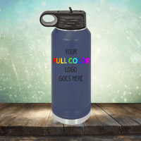 A blue Custom UV Printed Drinkware - ONE TIME SPECIAL OFFER with a black lid and handle from Kodiak Coolers is displayed on a wooden surface. The text on the bottle reads, "Your Full Color Logo Goes Here." Crafted with the precision of engraving, this product shines against a light, sparkly gradient background.