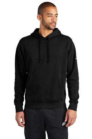 A person dressed in a Nike Club Fleece Sleeve Swoosh Pullover Hoodie Sweatshirt NKDR1499 and black pants, embodying a casual street-ready look, stands against a white background.