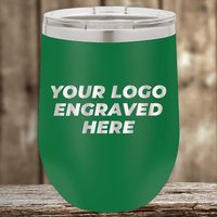 The Kodiak Coolers Realtor Closing Gifts for Clients features your custom company logo engraved on green insulated drinkware with a silver lid—perfect for promotional use—shown on a wooden surface against a blurred wood background.