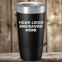 A black Kodiak Coolers tumbler with a silver lid sits on a wooden surface, featuring "YOUR LOGO ENGRAVED HERE"—ideal as Realtor Closing Gifts for Clients seeking custom company logo drinkware.