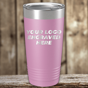A pink Kodiak Coolers tumbler with silver lid features "YOUR LOGO ENGRAVED HERE," ideal as a Realtor closing gift or personalized promo mug. Displayed on wood, it's custom drinkware for clients with your company logo.