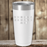 A white insulated tumbler from Kodiak Coolers with a metal lid rests on a wooden surface. "YOUR LOGO ENGRAVED HERE" is printed, making it ideal as a Realtor Closing Gift for Clients with your custom company logo.