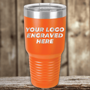 A large orange Kodiak Coolers tumbler with a clear lid and your custom company logo engraved—ideal as a Realtor closing gift or personalized drinkware for clients.
