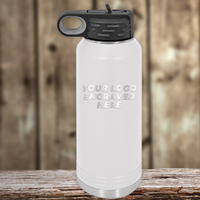 A Kodiak Coolers white stainless steel water bottle with a black lid and custom company logo engraving, displayed on wood—perfect as a realtor closing gift for clients or paired with personalized mugs.