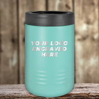 A turquoise Kodiak Coolers tumbler with a black lid rests on a wooden surface, featuring "YOUR LOGO ENGRAVED HERE"—the perfect Realtor closing gift with your custom company logo on drinkware.