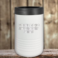 A white insulated tumbler with a black lid by Kodiak Coolers, engraved with "YOUR LOGO ENGRAVED HERE," sits on wood—ideal as Realtor Closing Gifts for Clients or custom company logo drinkware to promote your brand.