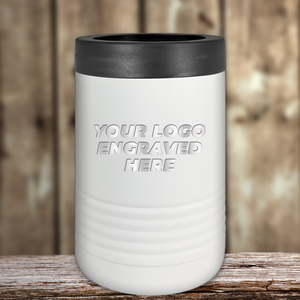 A white insulated tumbler with a black lid by Kodiak Coolers, engraved with "YOUR LOGO ENGRAVED HERE," sits on wood—ideal as Realtor Closing Gifts for Clients or custom company logo drinkware to promote your brand.