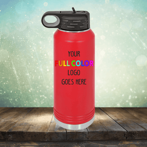 A Custom UV Printed Drinkware - ONE TIME SPECIAL OFFER from Kodiak Coolers with a black lid is shown on a wooden surface with a sparkling background. The text "Your Full Color Logo Goes Here" is displayed on the bottle, making it perfect for custom engraving.