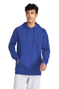 A person is wearing a Sport-Tek Drive Fleece Pullover Hoodie Sweatshirt STF200 in blue and gray pants, standing with one hand in the pocket.