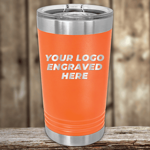 The Kodiak Coolers Realtor Closing Gifts for Clients tumbler features your custom company logo engraved in white on orange drinkware with a clear lid, ideal for promotional gifts or custom logo mugs.