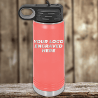 A coral-colored Kodiak Coolers water bottle with a black lid sits on a wooden surface, featuring "Your Custom Company Logo"—the ideal Realtor Closing Gift and perfect for your collection of custom logo mugs and drinkware.