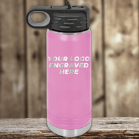 Kodiak Coolers pink water bottle with black lid and handle, custom-engraved with your company logo—ideal Realtor closing gift for clients—shown on a wooden surface with a blurred wood background.