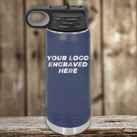 A blue stainless steel water bottle by Kodiak Coolers with a black lid, engraved with your custom company logo—ideal as Realtor Closing Gifts for Clients—displayed on a wooden surface with a blurred background.