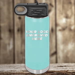 A Kodiak Coolers light blue insulated water bottle featuring your custom company logo engraved on the front—ideal realtor closing gift drinkware for clients, complete with a black lid and handle to showcase your brand.