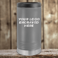 A gray Kodiak Coolers tumbler with "YOUR LOGO ENGRAVED HERE" on the front, ideal as a Realtor Closing Gift for Clients. Your custom company logo can be engraved on this promotional drinkware.