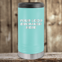 A light blue Kodiak Coolers tumbler with black lid and silver base, engraved with your company logo, makes the perfect Realtor closing gift—custom promotional drinkware for clients—displayed on wood with a blurred background.