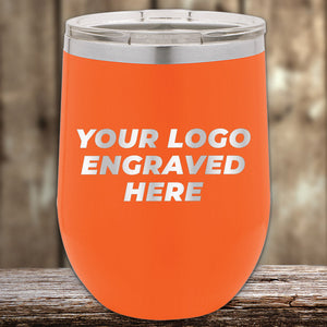 Orange insulated Custom Wine Cups 12 oz with your Logo or Design Engraved - Low 6 Piece Order Minimal Sample Volume, a perfect promotional item, with customizable engraving area displayed on a wooden surface by Kodiak Coolers.