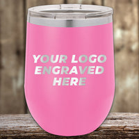 Promotional items: Kodiak Coolers Custom Wine Cups 12 oz with your Logo or Design Engraved - Low 6 Piece Order Minimal Sample Volume Pink insulated tumbler displayed on wooden surface.