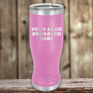 Pink insulated Custom Pilsner Tumbler 14 oz with your Logo or Design Engraved - Low 6 Piece Order Minimal Sample Volume displayed on a wooden surface by Kodiak Coolers.