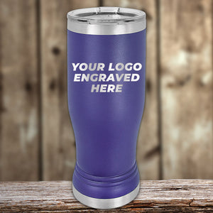 Customizable Kodiak Coolers purple Pilsner Tumblers 14 oz with "your logo engraved here" text displayed on wooden surface, featuring laser engraving options.