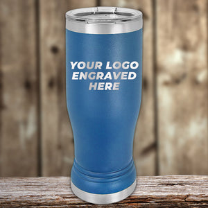 Blue Custom Pilsner Tumbler 14 oz with laser engraving space displayed on a wooden surface by Kodiak Coolers.